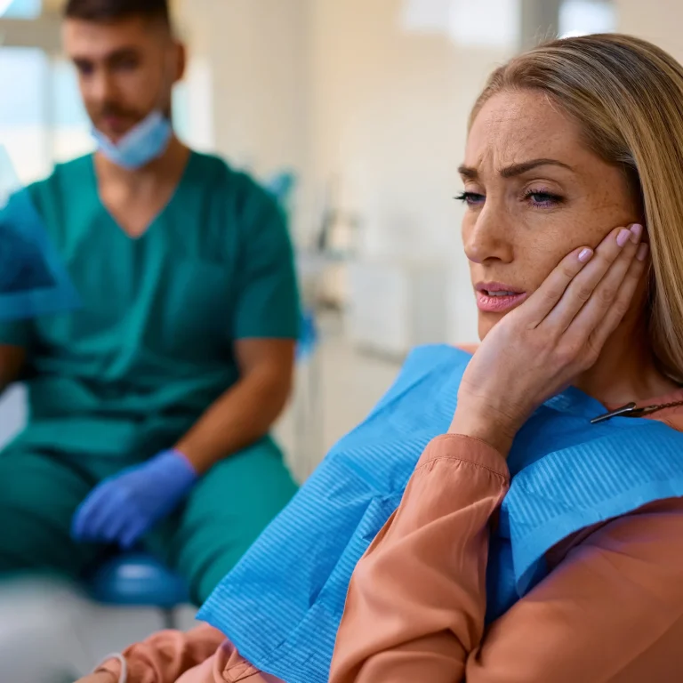 Woman with a toothache at the dental office
