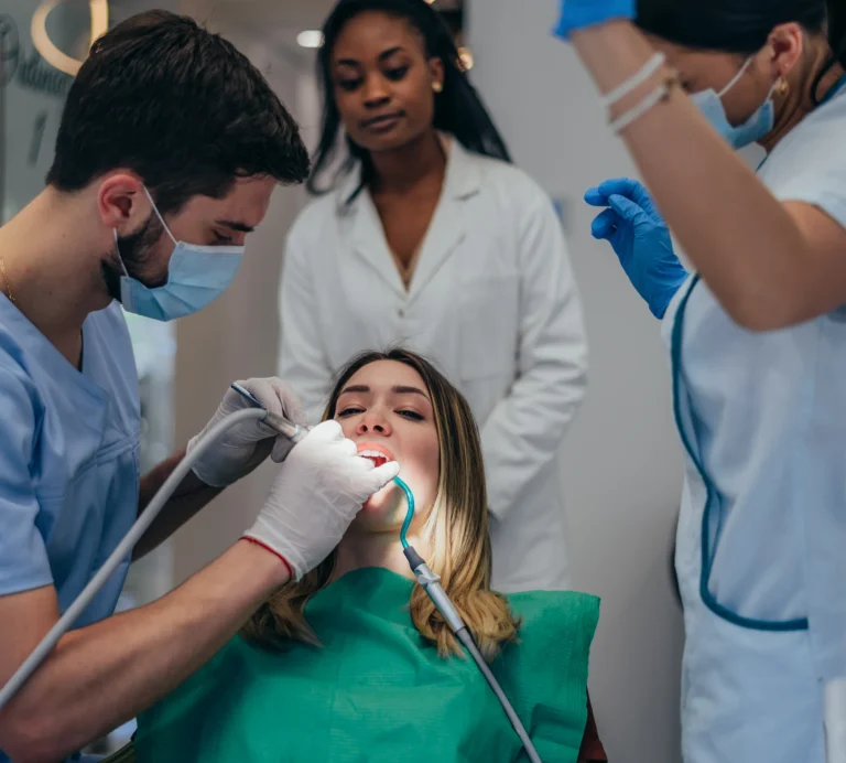 Dentist examining a cracked tooth during an emergency visit